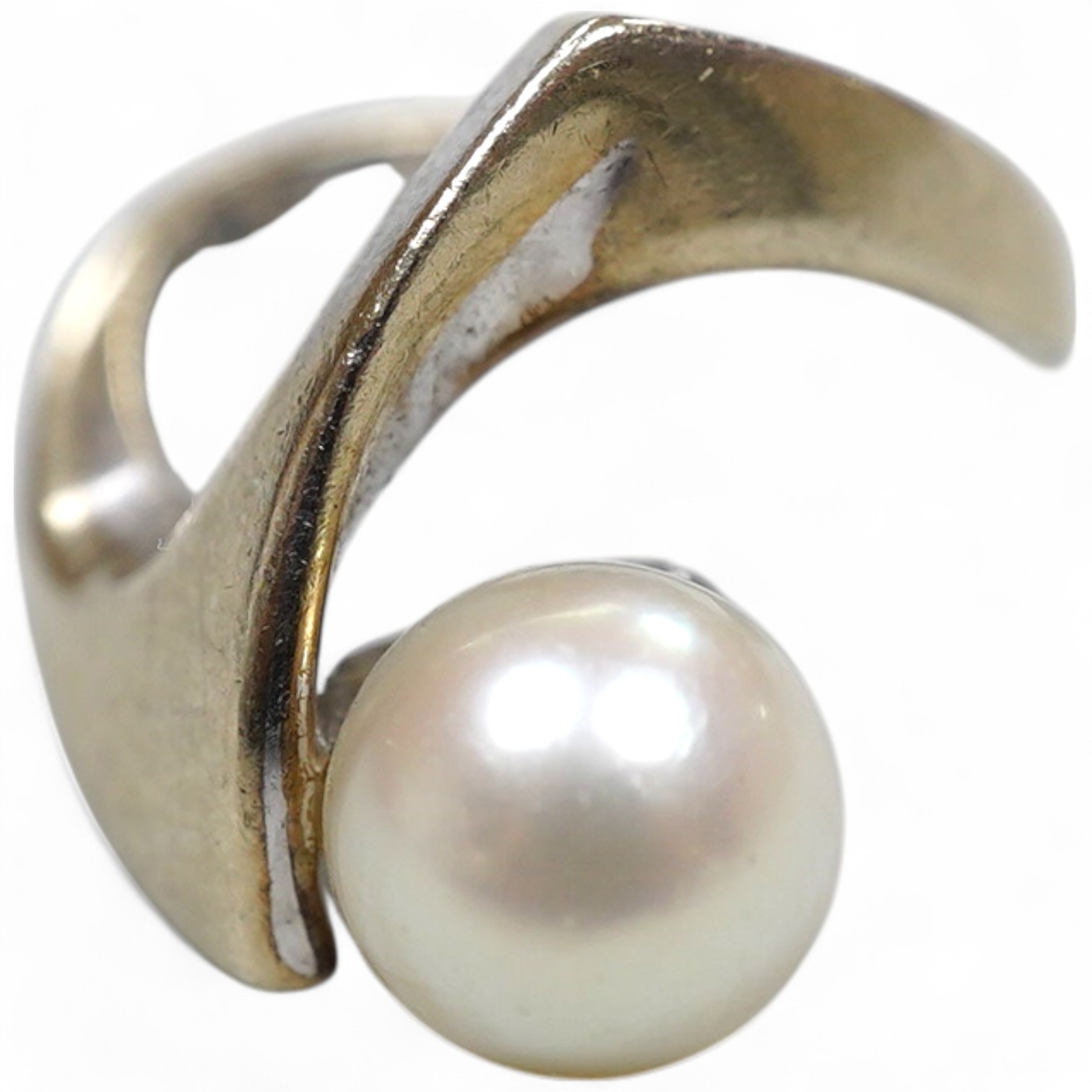 A cultured pearl ring, set with a cultured pearl, to an asymmetrical curved mount in white gold, size J1/2, stamped K14WG, maker's mark, gross weight 6 grams, Condition: Overall good - wear to rhodium, glue residue to ba